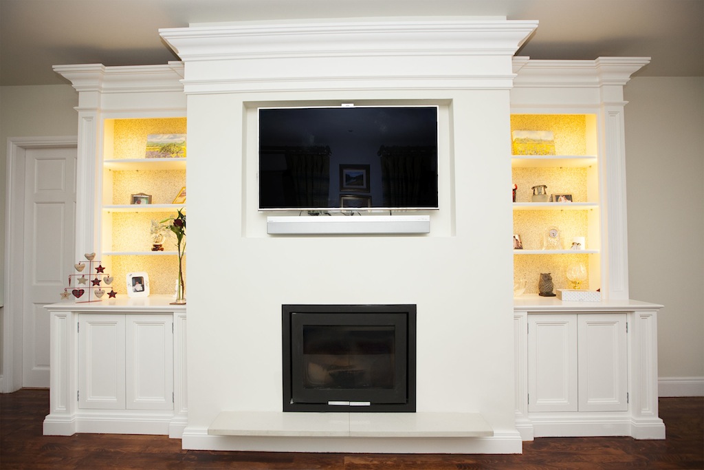 A bespoke fitted living-room unit with media wall and cabinetry by Willow Design
